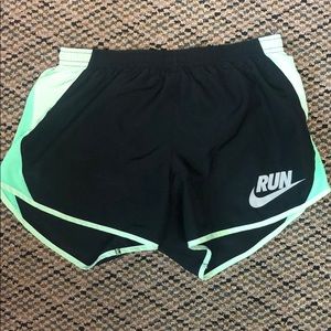 NIKE runner shorts.